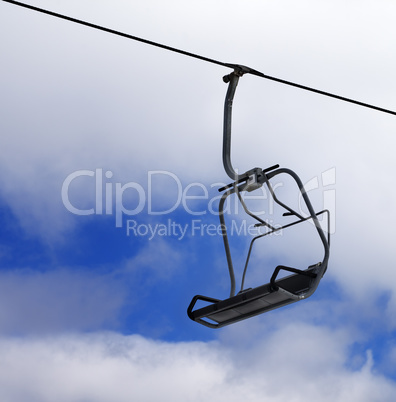 Chair-lift and cloudy sky