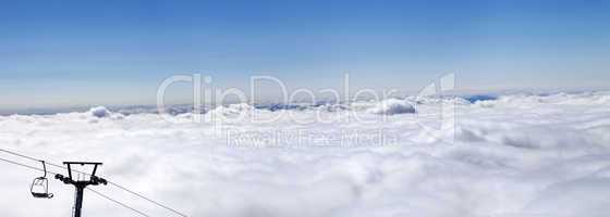 Panorama of mountains under clouds at nice sun day