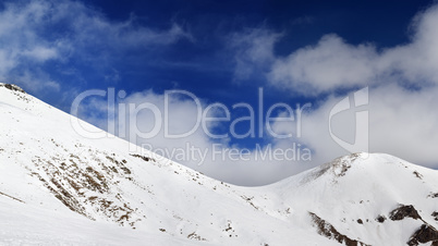 Panorama of mountain pass and off-piste slope