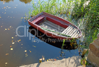 Small red Boat at the Lake