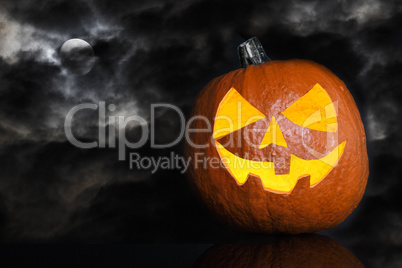 Pumpkin on a black cloudy background for Halloween