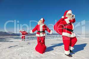 Three  Santa Claus outdoors