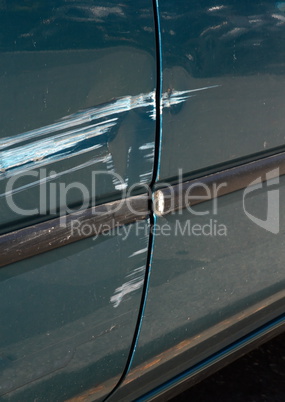 Scratched door paint on a car