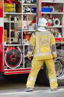 Firefighter discussing next to fire truck, Geneva, Switzerland