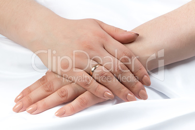 Photo of woman's hands crossed