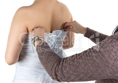 Photo of bride's back and bridesmade