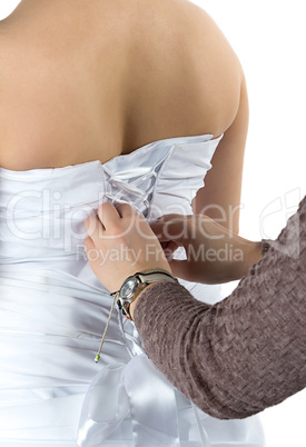 Image of bride's back and bridesmade