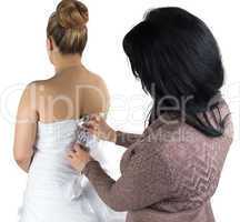 Image of bridesmade and bride in dress from back
