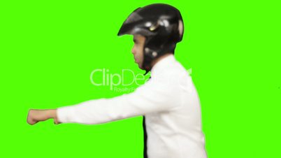 Young man imitating as riding motorcycle