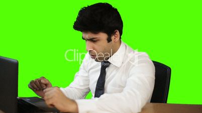 Businessman working on a laptop in office