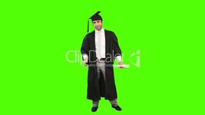Man in graduation gown holding a diploma