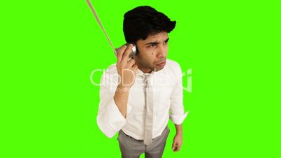 Young businessman using tin can phone