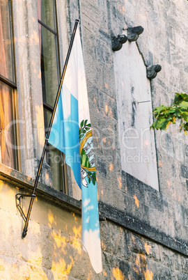 Flag of San Marino out of a medieval building