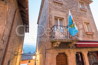 Flag of San Marino out of a medieval building