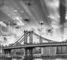 New York. Manhattan Bridge and city skyine at dusk