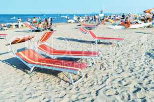 Colourful beach chairs and sun beds