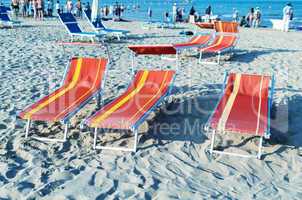 Colourful beach chairs and sun beds