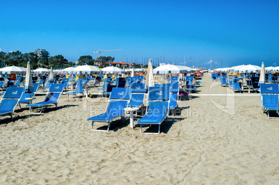 RIMINI, ITALY - SEPTEMBER 8, 2014: Colourful chairs on the beach