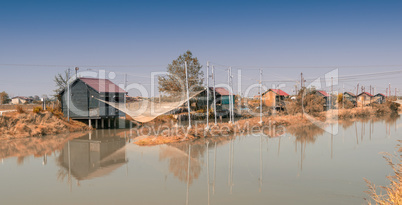 Fishing huts in Italy. People fish, cook and eat here