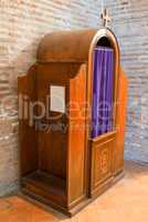 Confession box inside an italian church