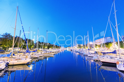 RIMINI, ITALY - SEPTEMBER 6, 2014: Night view of marina with boa