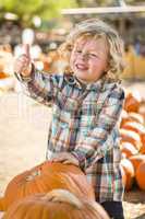 Cute Little Boy Gives Thumbs Up at Pumpkin Patch