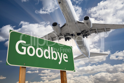 Goodbye Green Road Sign and Airplane Above