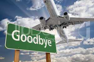 Goodbye Green Road Sign and Airplane Above