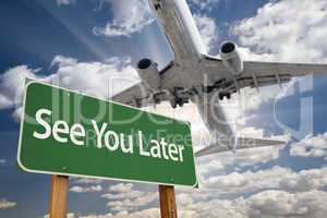See You Later Green Road Sign and Airplane Above