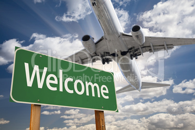 Welcome Green Road Sign and Airplane Above