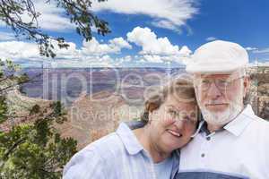 Happy Senior Couple Posing on Edge of The Grand Canyon