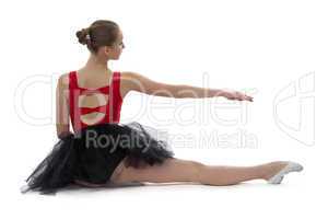 Young ballerina sitting back