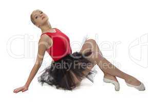 Image of young ballerina sitting on the floor