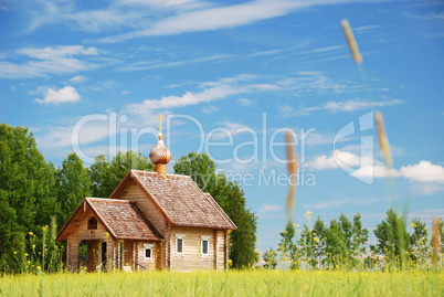 Finnish landscape with small wooden church.