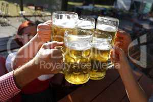 People drinking beer in a traditional Bavarian beer garden