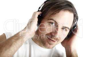 Attractive man with headphones in front of a white background lo