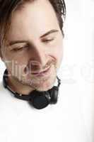Attractive man with headphones in front of a white background