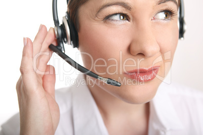 Young woman with headset has problems to understand the caller