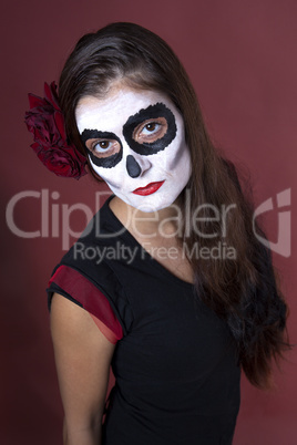 Woman with makeup of la Santa Muerte with red roses