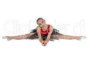 Young ballerina sitting on the floor