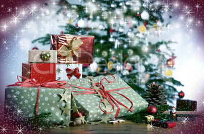 Christmas gifts in front of Christmas tree and stars