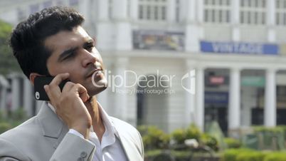 a businessman talking on a mobile phone
