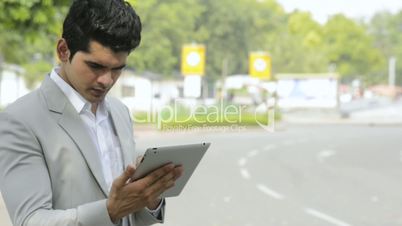 a businessman using a digital tablet