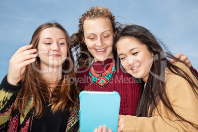 Women look on her tablet computer