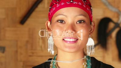 Locked-on shot of a Naga tribeswoman in traditional outfit during Hornbill Festival