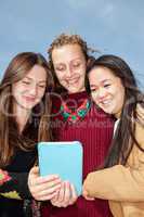 Women look on her tablet computer