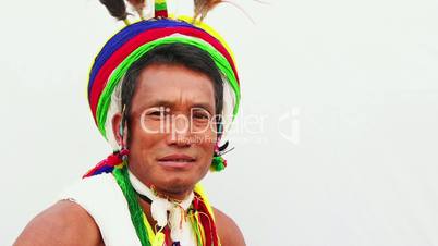 Locked-on shot of a Naga tribesman in traditional outfit during Hornbill Festival