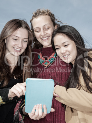 Women look on her tablet computer