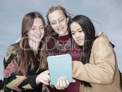 Women look on her tablet computer