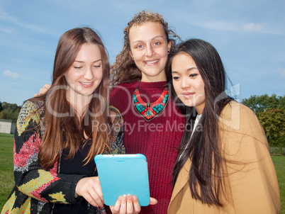 Women look on her tablet computer